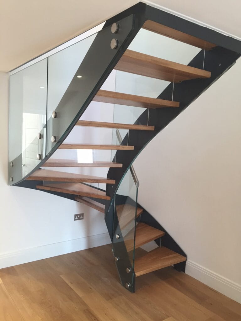 Striking Internal Metal Staircase in Anthracite Grey with glass balustrade