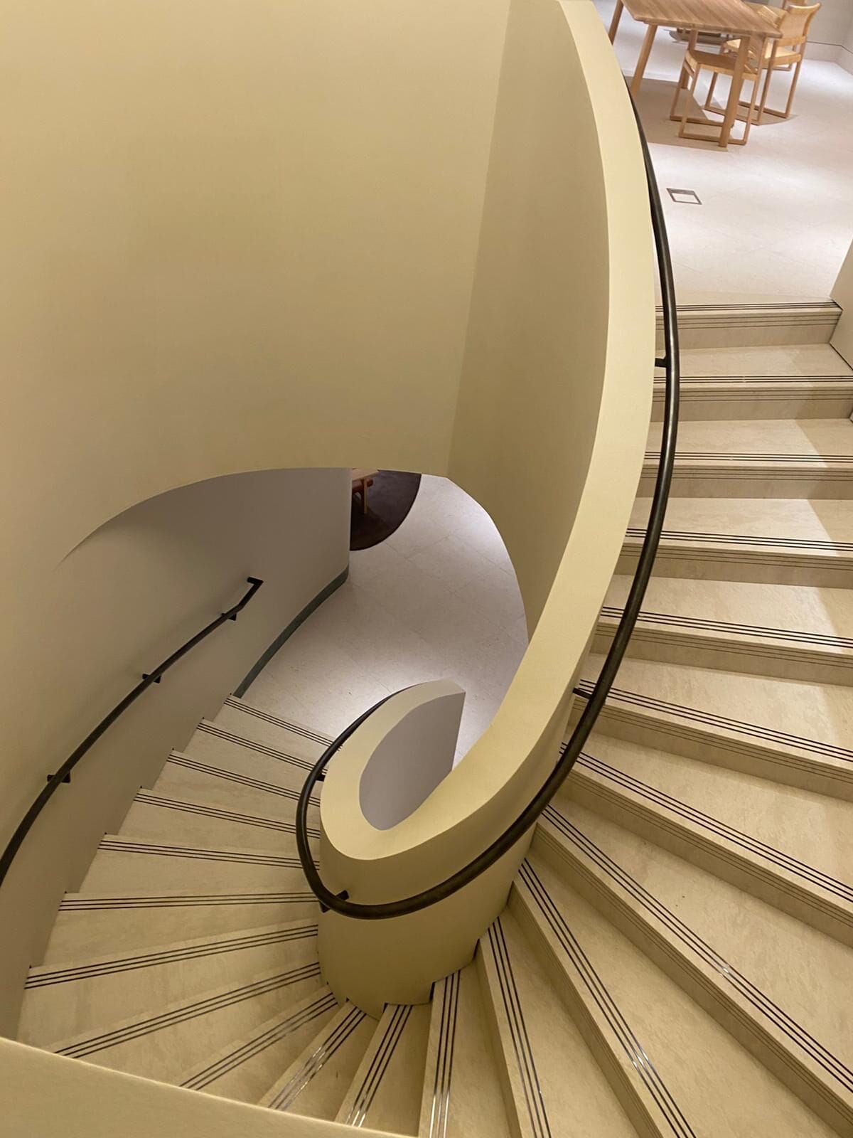 Stone Clad Curved Metal Staircase